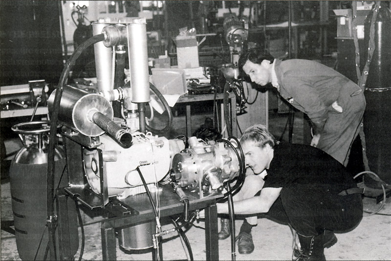 Picture of the the engine and compressor being set up for test by Jo and Dewi